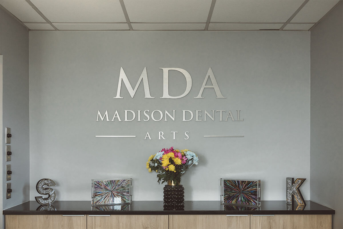 Dentist Explaining Services at Madison Dental Arts